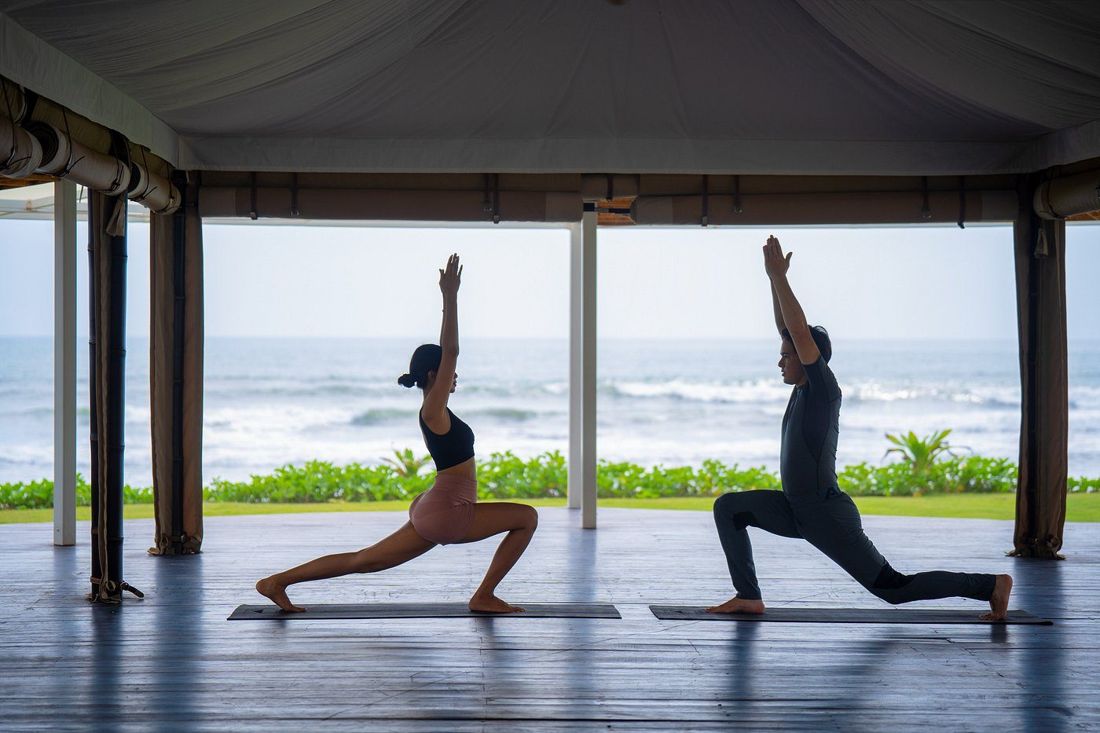 Morning yoga in the beachfront pavilion