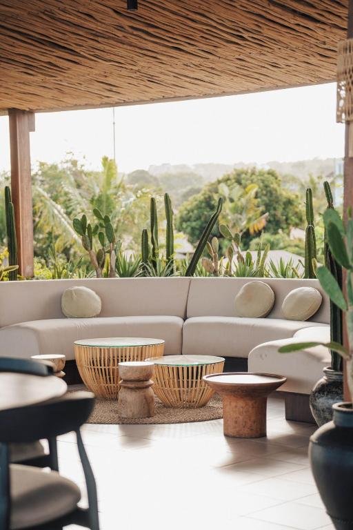 Curved lounge sofa among the cactus garden