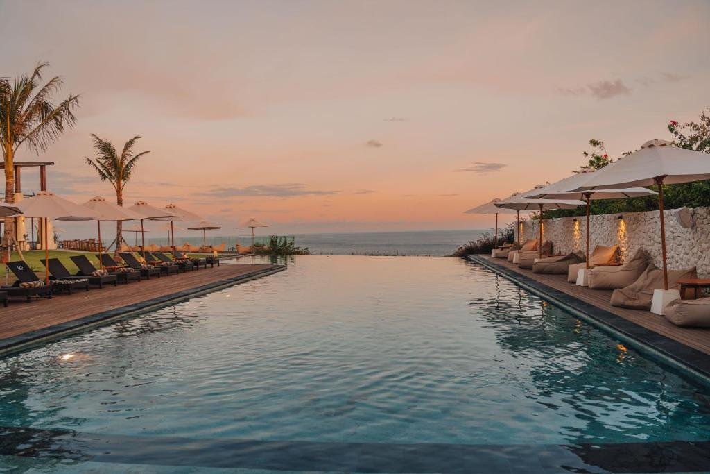 The infinity pool looking out to the ocean at dusk