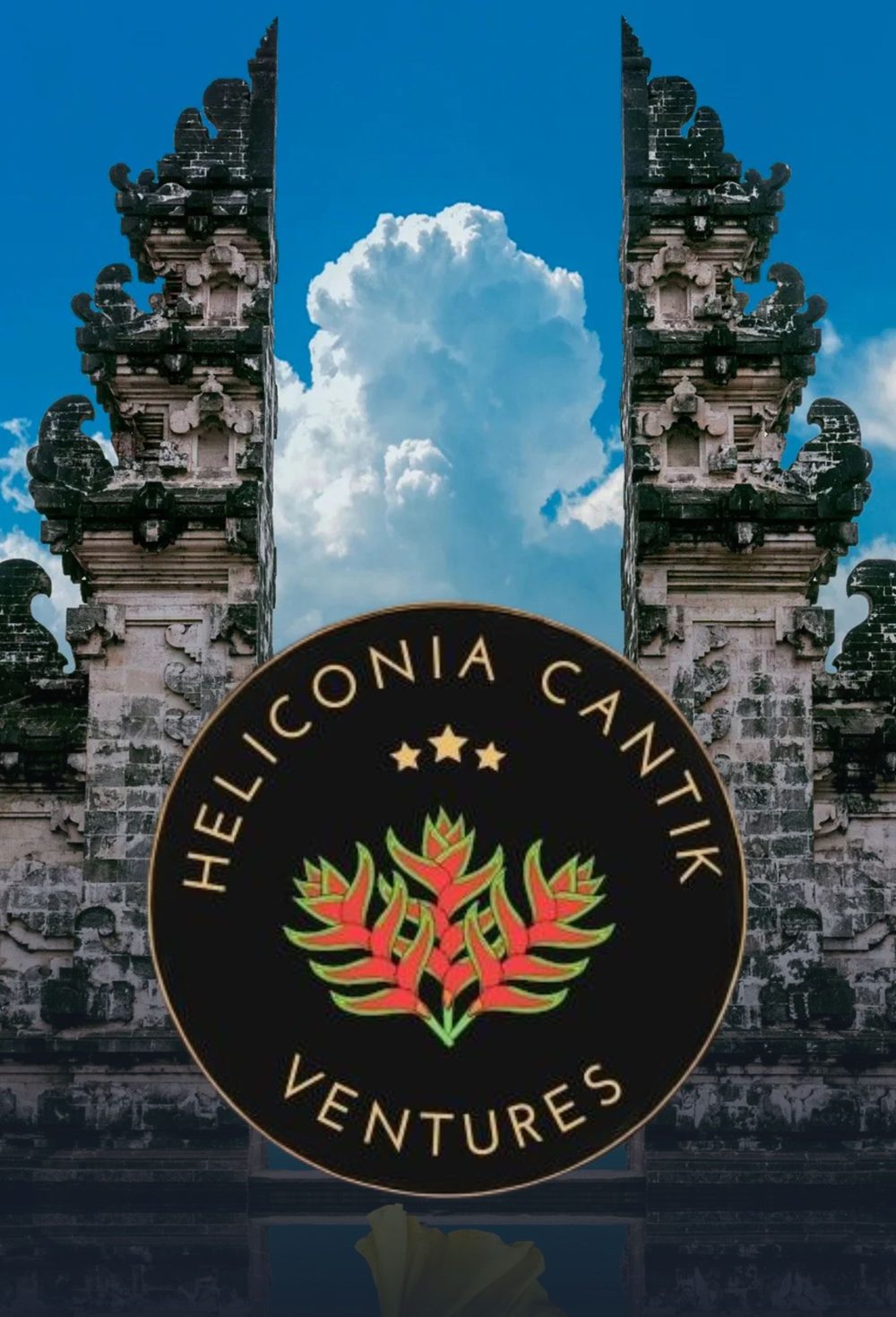 Balinese temple gate with the Heliconia Cantik Ventures crest